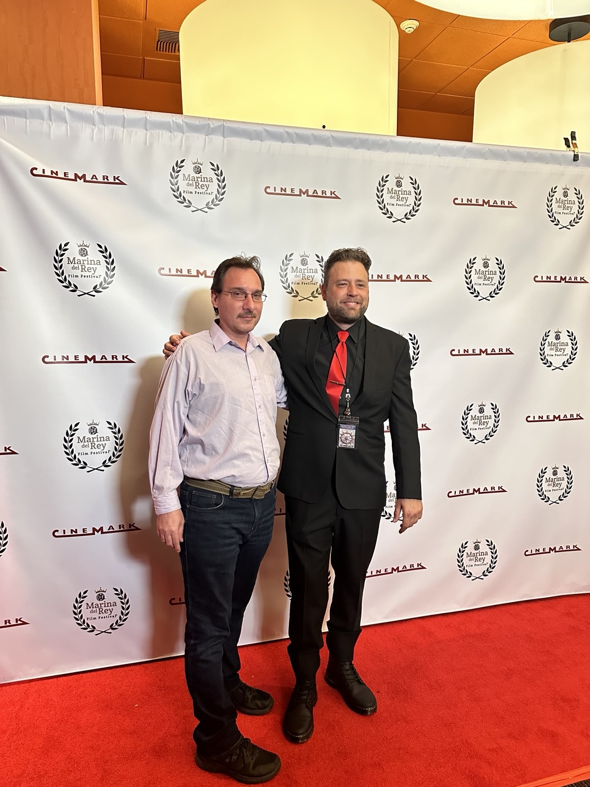 C.J. Guerrero with a fellow attendee on a film festival red carpet
